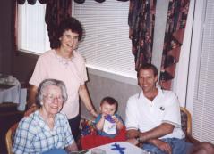 Grandma, Gail, Will (in high chair), and Greg