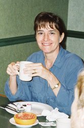 Nancy Batchelder holding a coffee mug