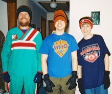 Scott, Kevin, and Phil pose dressed in gloves and hats.