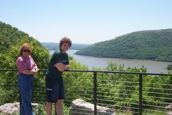 Kathy and Kevin at an overlook with the Hudson River and green hills