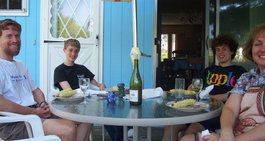 patio table with Scott, Phil, Kevin, and Kathy seated around