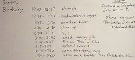 Schedule displayed on white board, listing church, badminton/croquet, serve & eat dinner, clean-up, SET, cake & opening gifts, Mexican Train or Clue, optional exercise, poetry, Bible reading, song, watch movie, possibly The Philadelphia Story