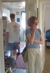 Jocelyn on the cell phone in her apartment, with Phil