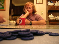 'Sequence' chips in the foreground, with a 'Sequence' board, Kathy, and a cup of tea