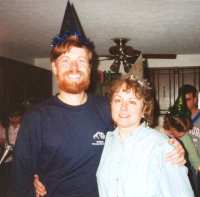 Scott and Kathy wearing party hats
