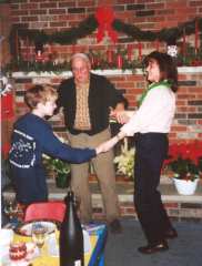 Phil, Grandpa, and Nancy dance holding hands