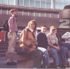 Scott, Nancy, and family in front of an office building