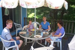 Phil, Will, DeeAnn, and Gail, happily seated around the patio table after lunch