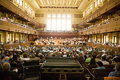 interior of concert hall, with orchestra and audience